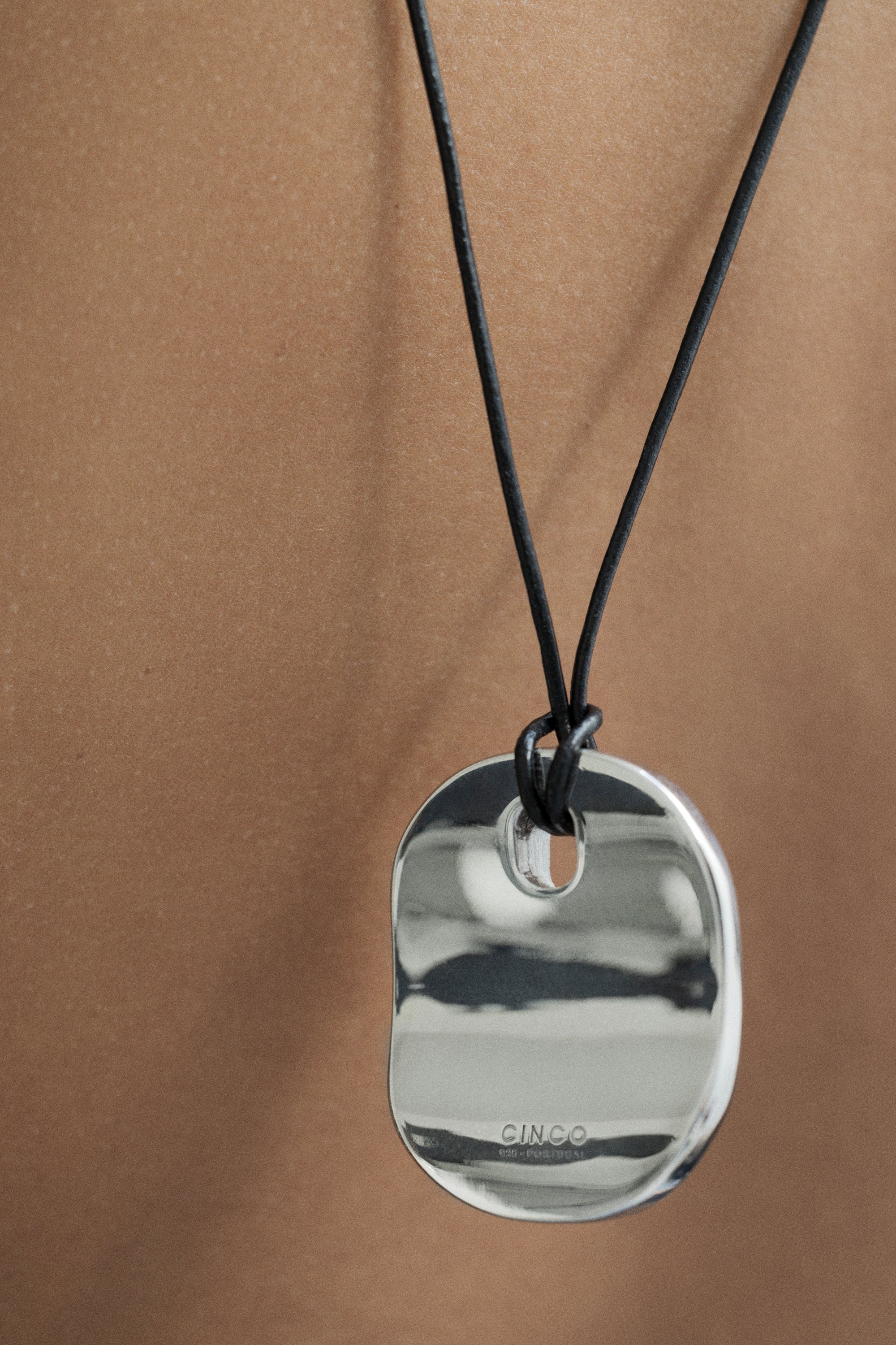 model wearing calin necklace in silver