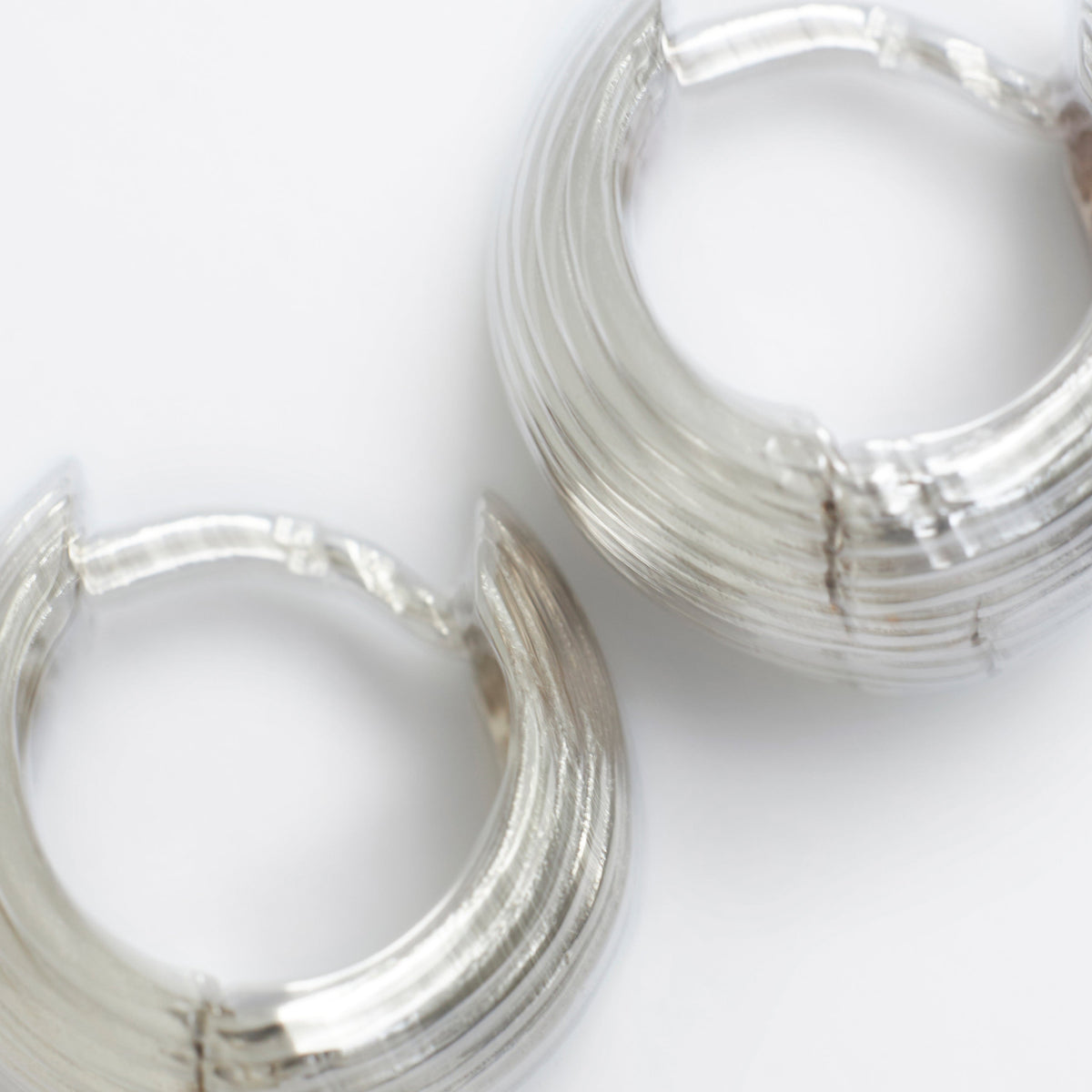 earrings in silver stand in a table perfect for everyday use