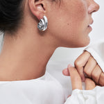 model wearing sia earrings ins silver