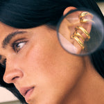 model wearing bella earcuff and charli earcuff in gold