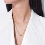 model wearing alphabet necklace with pendant C in gold