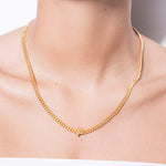model wearing alphabet necklace with pendant F in gold