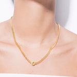 model wearing alphabet necklace with pendant O in gold
