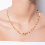 model wearing alphabet necklace with pendant T in gold