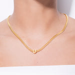 model wearing alphabet necklace with pendant U in gold