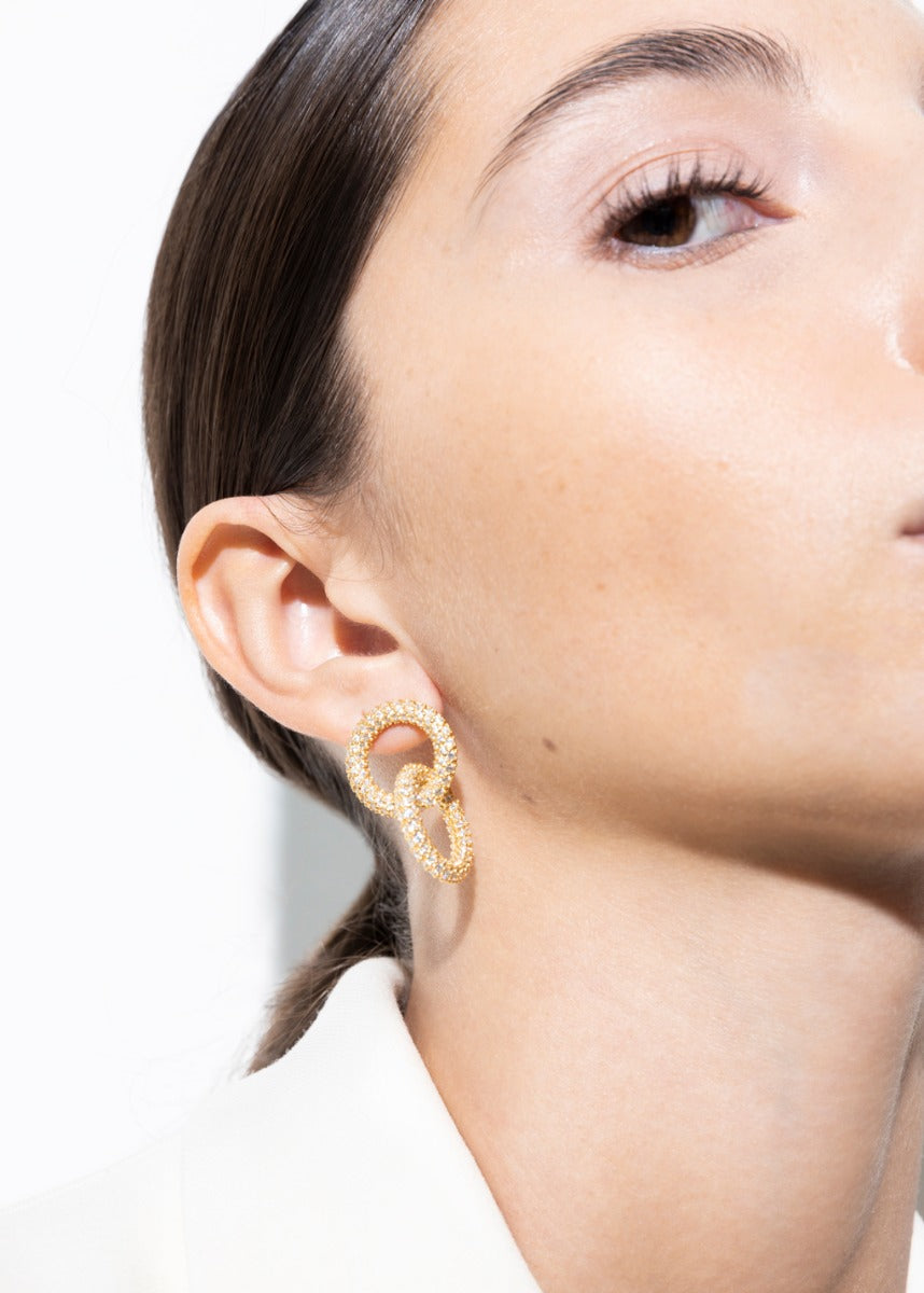 model wearing andreea earrings in gold