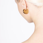 model wearing bailey earrings in gold