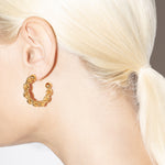 model wearing bia earrings in gold