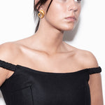 model wearing camille earrings in gold