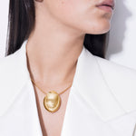 model wearing chéri necklace in gold