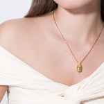 model wearing constantin necklace in gold