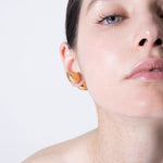 model wearing constantin piercing in gold