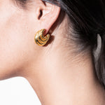 model wearing daphne earrings in gold