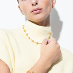 model wearing elin necklace and elin bracelet in gold