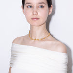 model wearing elin necklace in gold