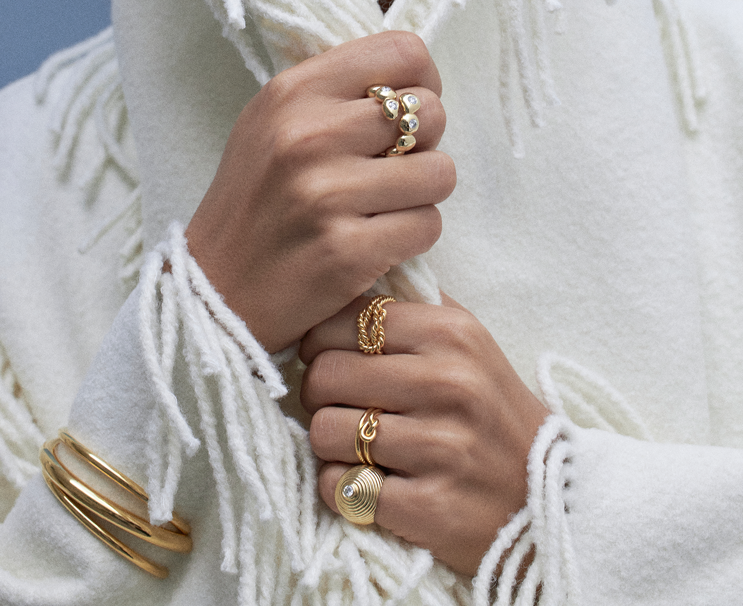 multiple gold rings and gold bracelets 
