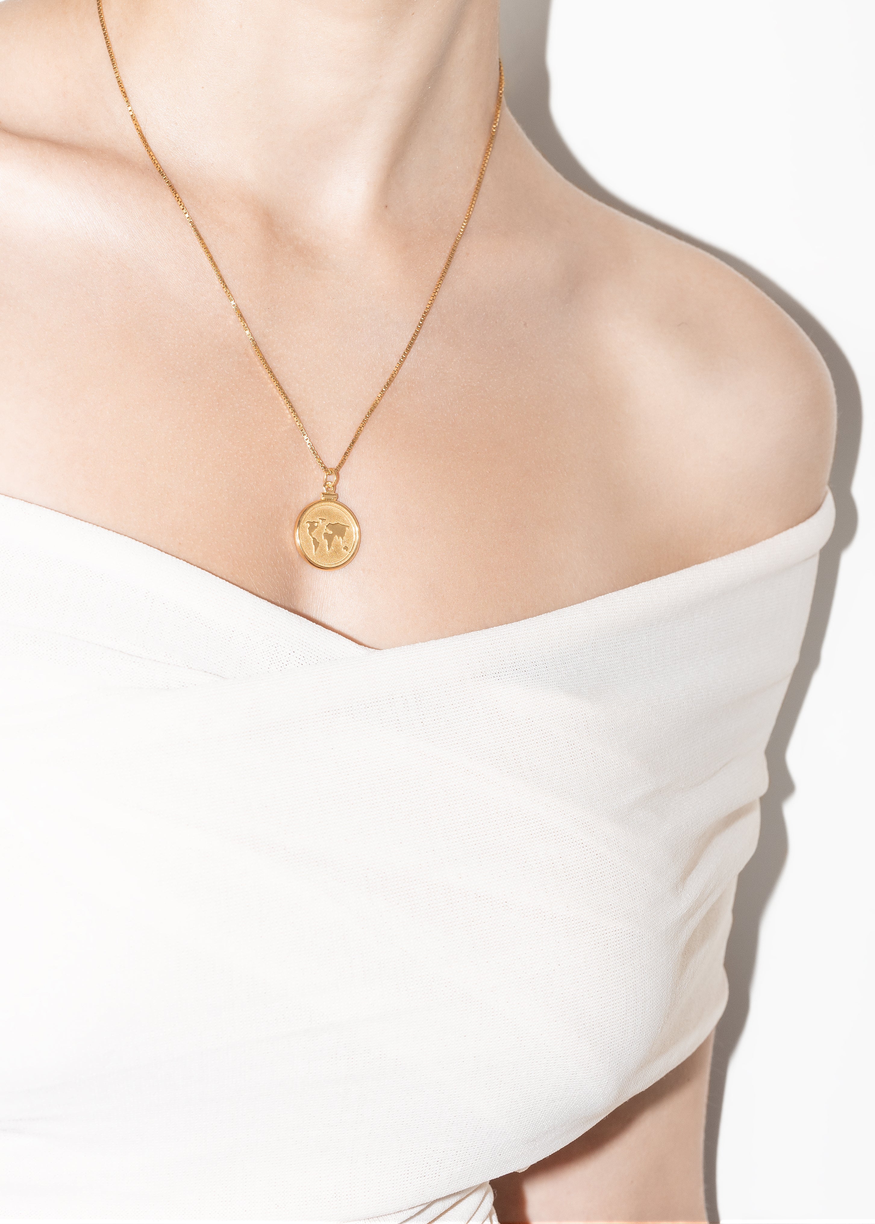 model wearing ginger necklace in gold