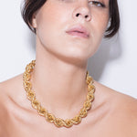 model wearing goliath bia necklace in gold