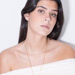 model wearing joan necklace in gold