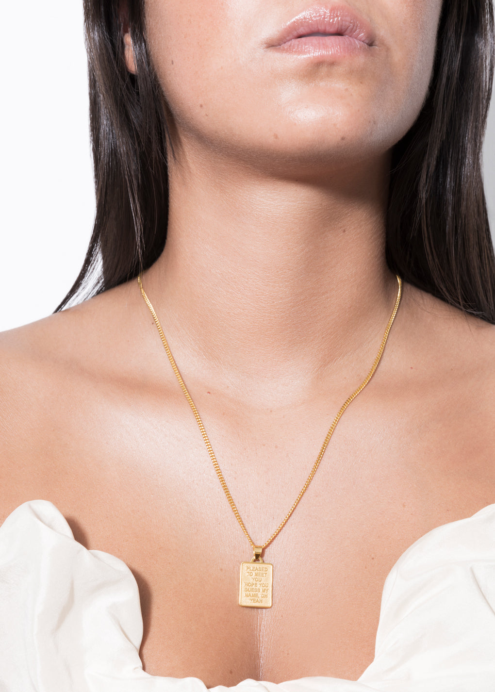 model wearing jodie shaped necklace in gold