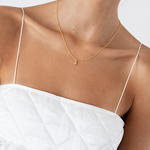 model wearing li necklace in gold