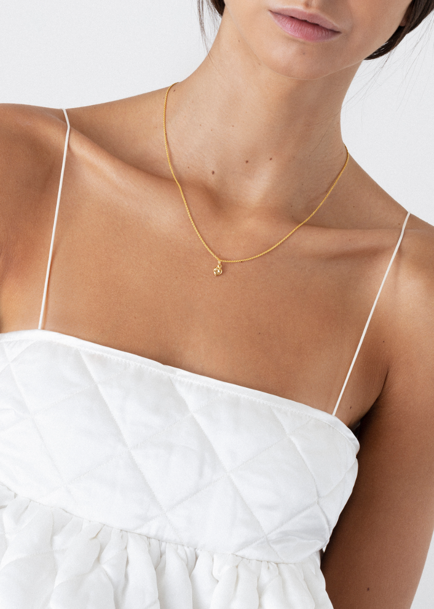 model wearing li necklace in gold