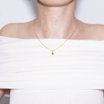 model wearing li necklace in gold