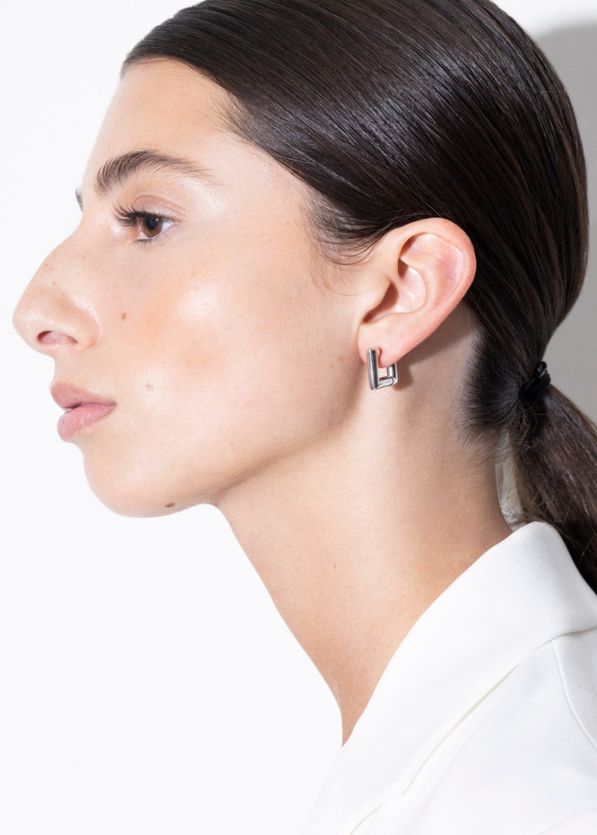 model wearing lizzie earrings in silver