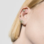 model wearing mush stud 18k emerald