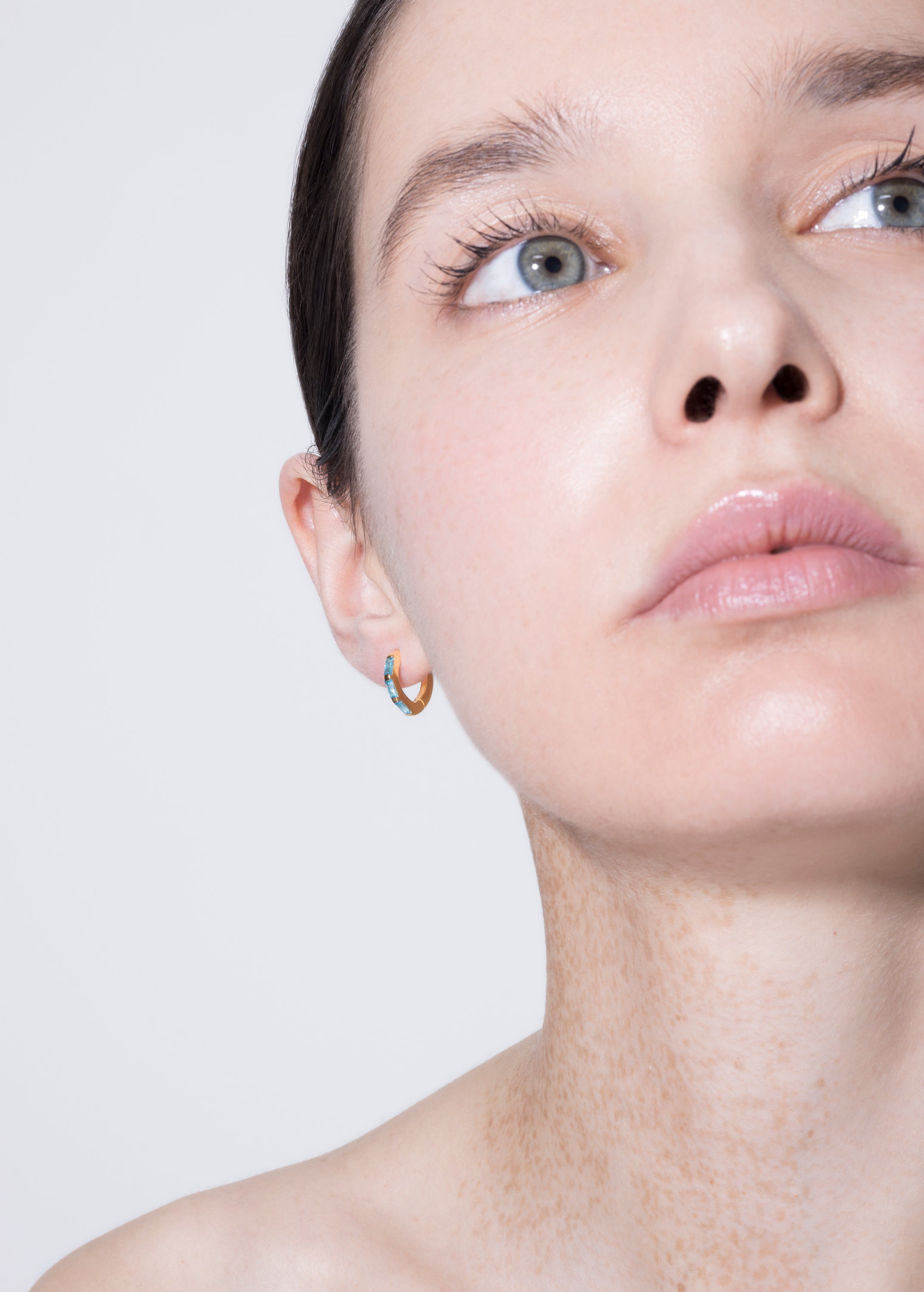 model wearing norma earrings turquoise in gold