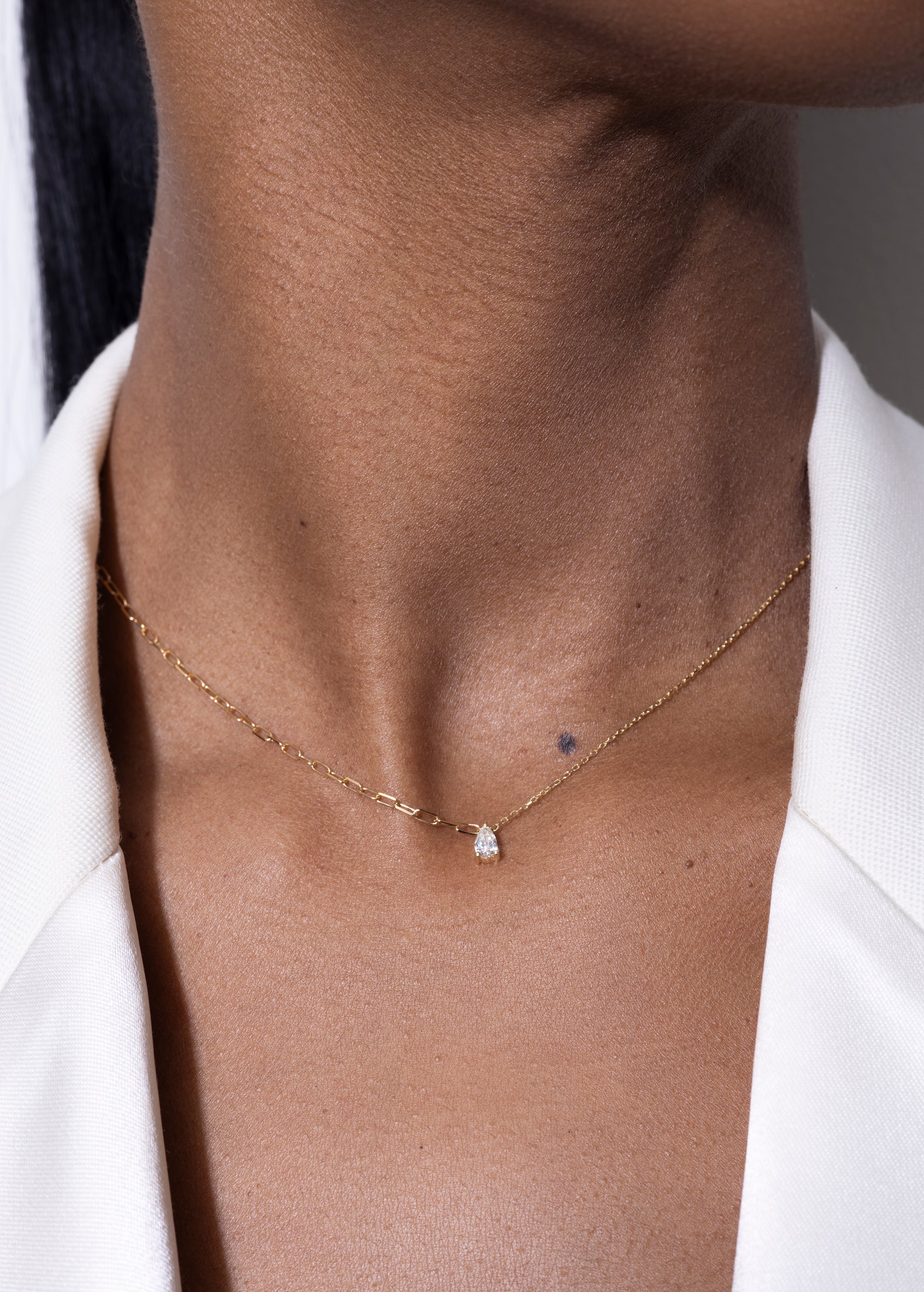 model wearing pear necklace 18k diamond