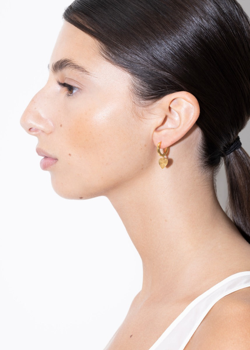 model wearing rosie earrings in gold