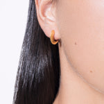 model wearing mini sarah polished earrings in gold