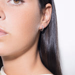 model wearing mini sarah polished earrings in silver