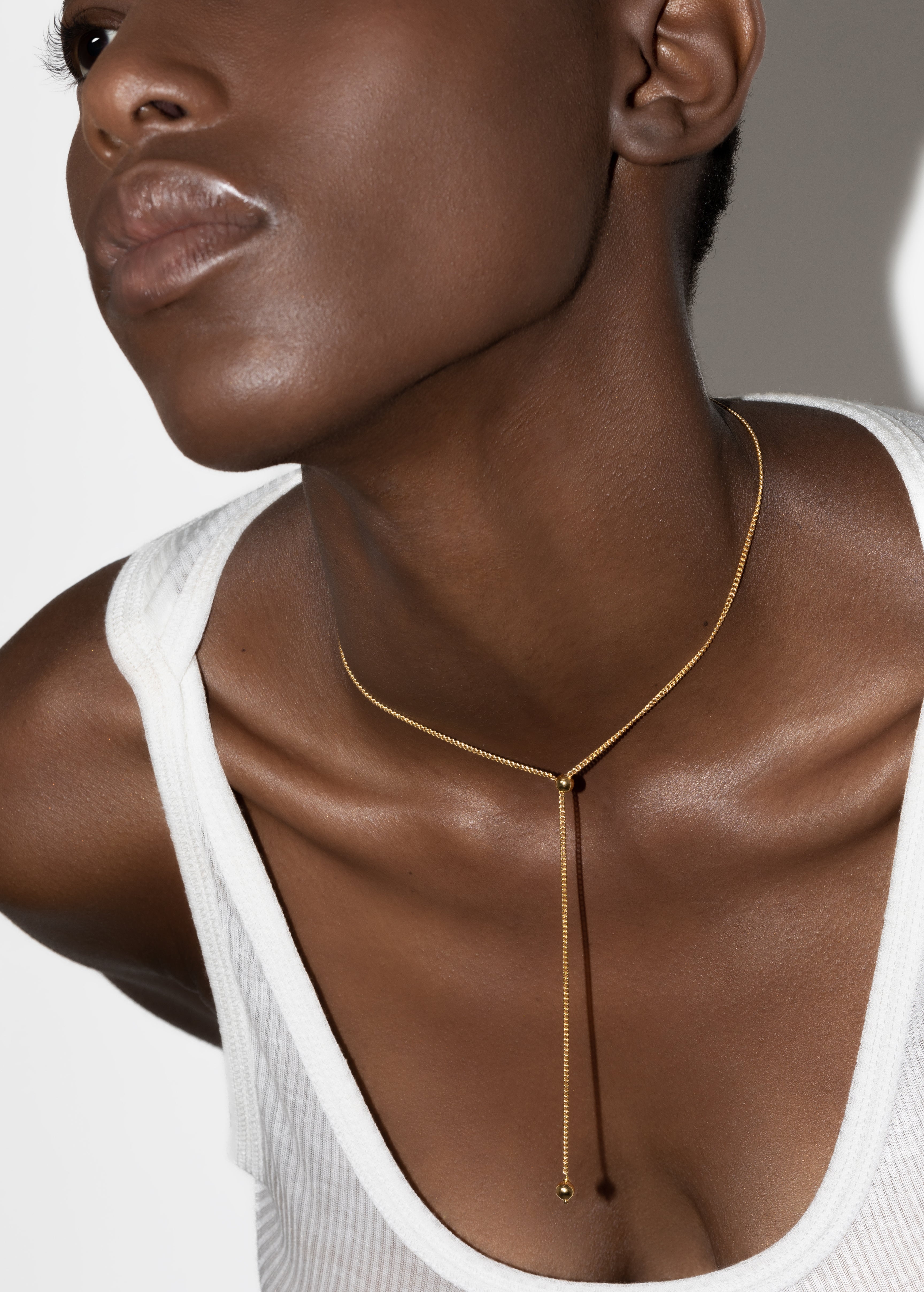 model wearing scarlett necklace in gold