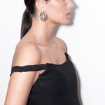 model wearing violet earrings in silver