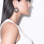 model wearing violet earrings in silver